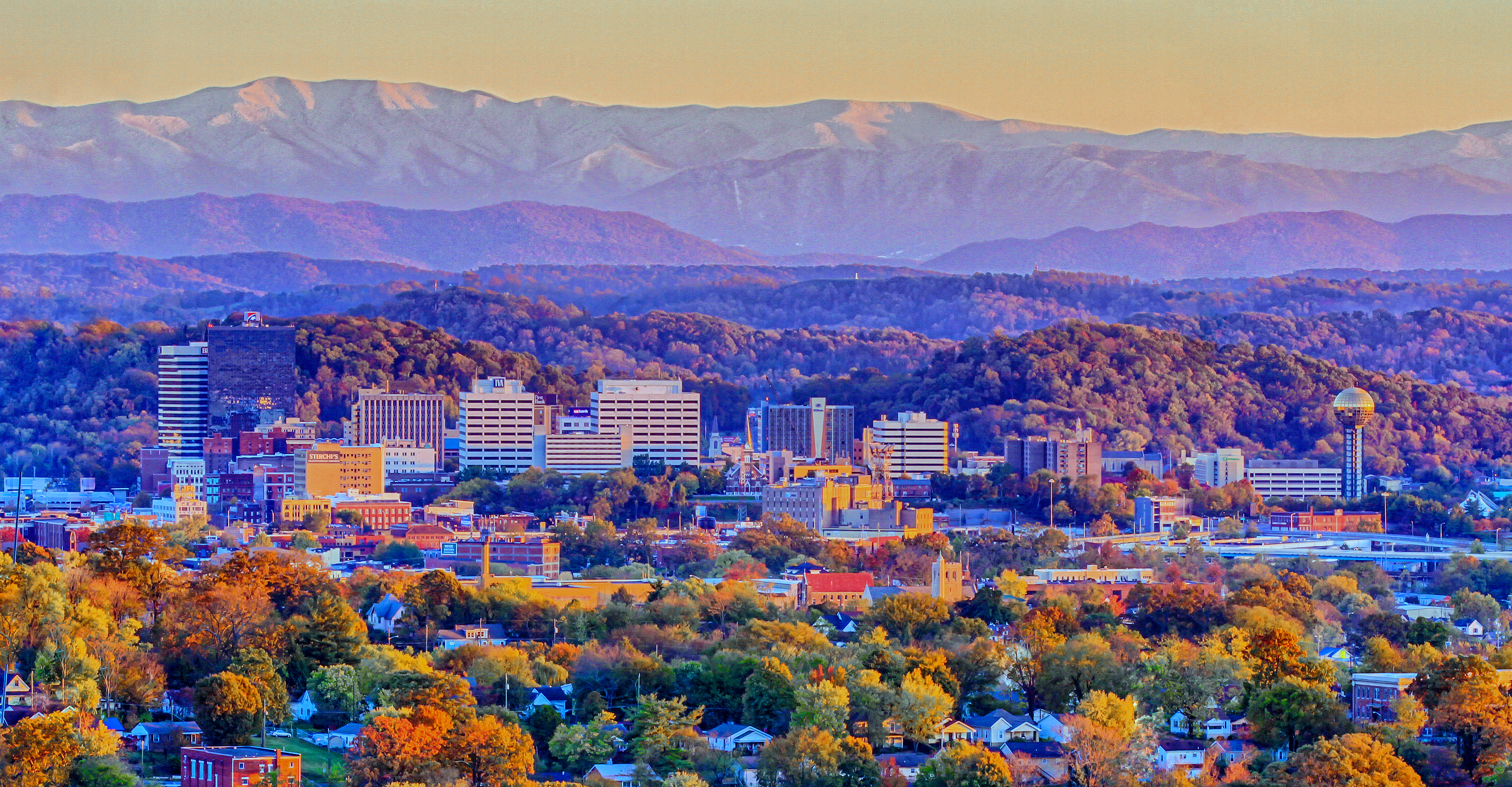 Image of downtown Knoxville and the smoky mountains